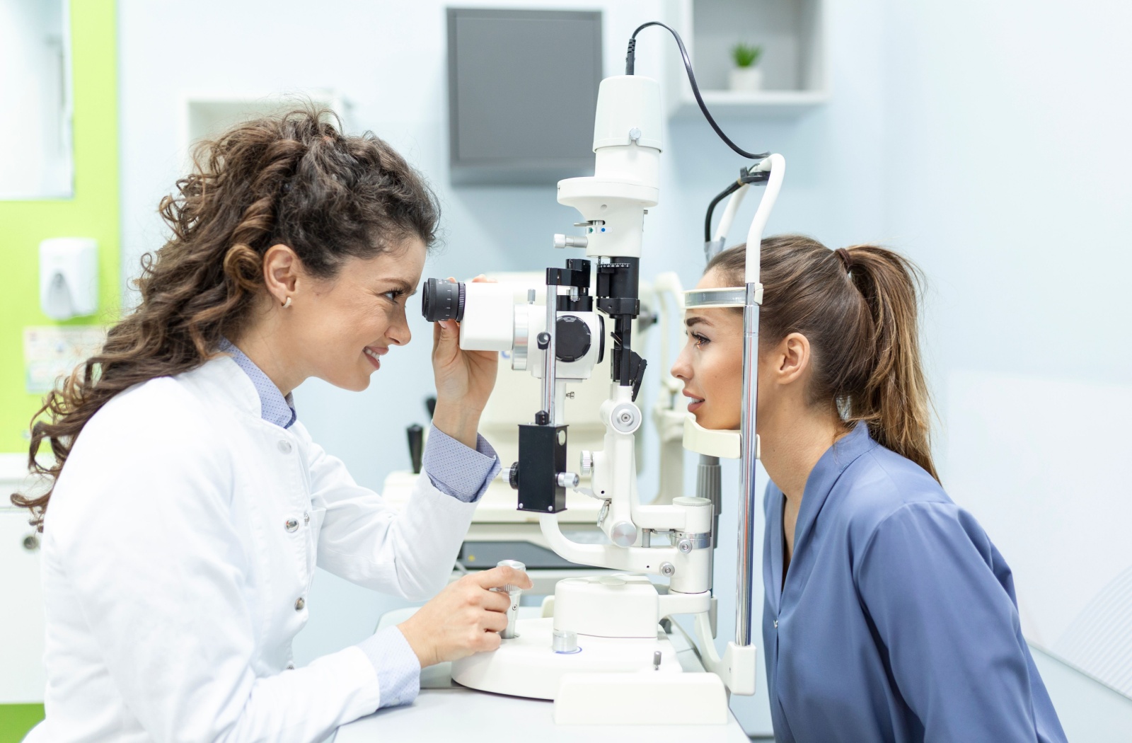 An eye doctor examines their patient's eye health to determine their eligibility for laser eye surgery.
