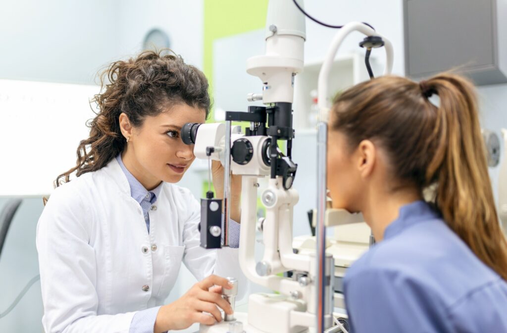 A patient with an optometrist in Whitby during a comprehensive eye exam.